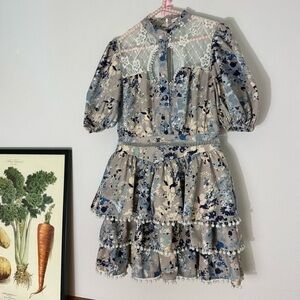 By Egreis gray floral poufy tiered dress with pompom trim size M
